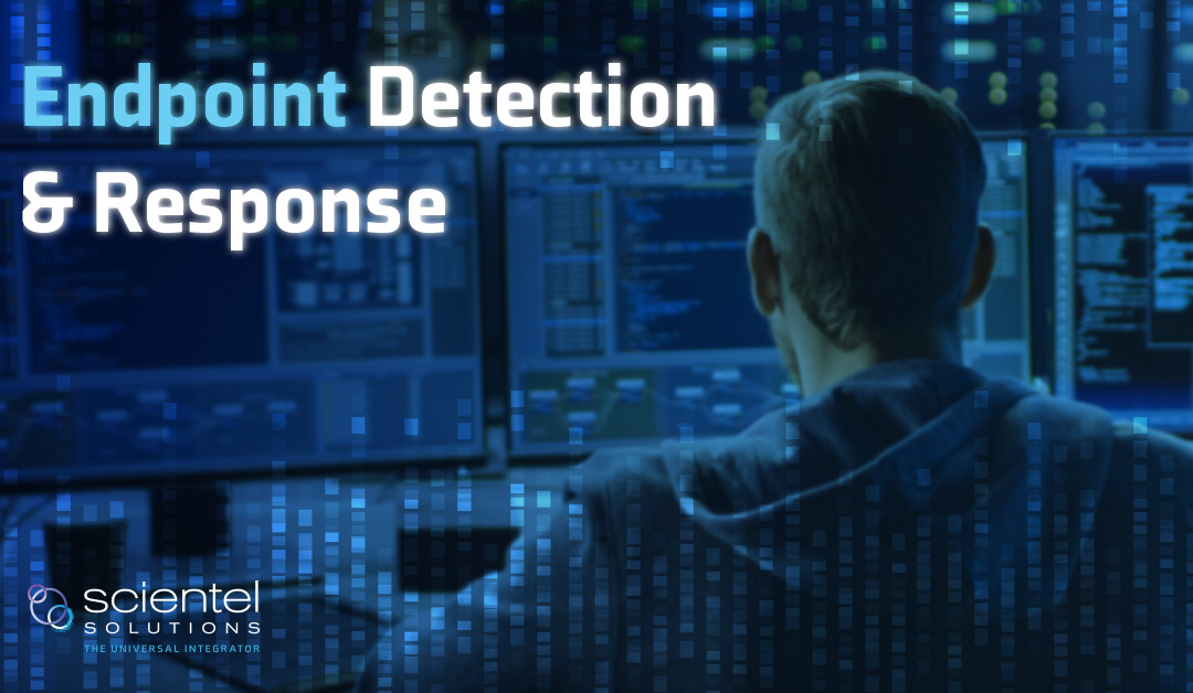 Image text states “Endpoint Detection & Response” Image is a man sitting in front of multiple computer screens monitoring various things